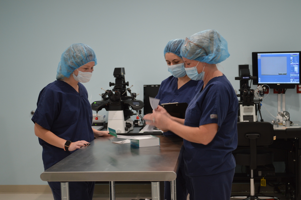 nurses working around a table at fertility clinic